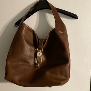 Dooney&Bourke purse ONLY. Carried it once.